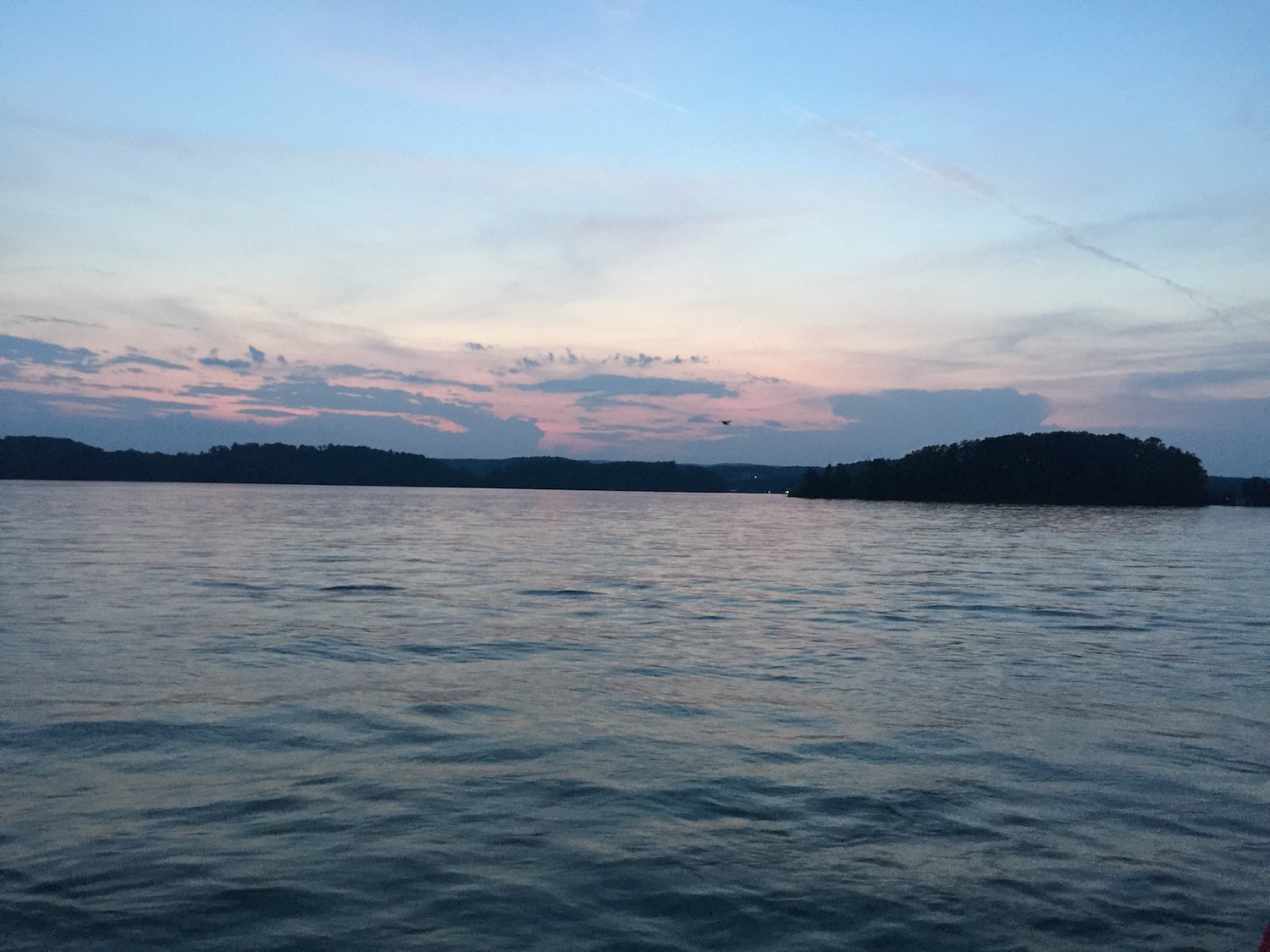 Serene NC lake at dusk — one of the lakes we fish